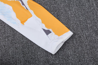 Buzo Completo Real Madrid Diseño Blanco y Naranja