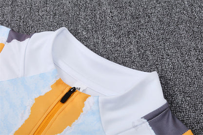 Buzo Completo Real Madrid Diseño Blanco y Naranja